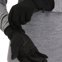Person wearing Icebreaker black gloves with textured palm