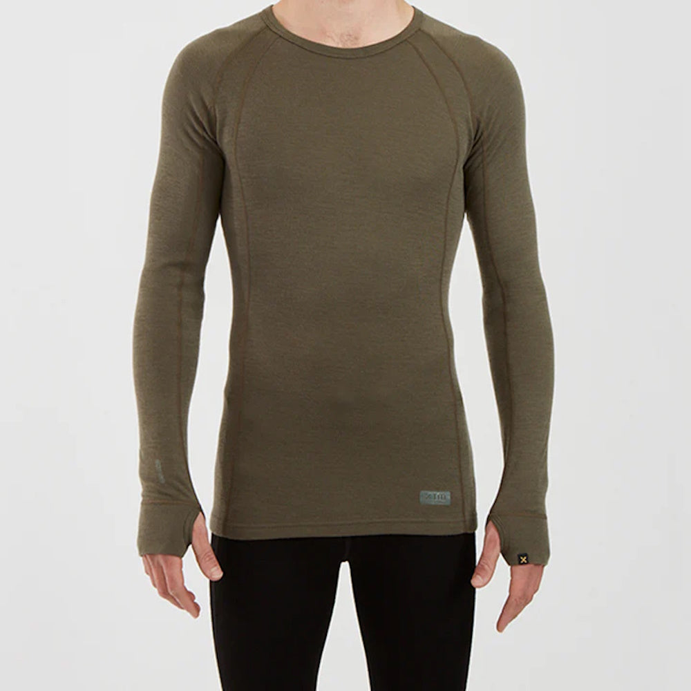 Front of model wearing XTM Mens Merino Top in Kalamata