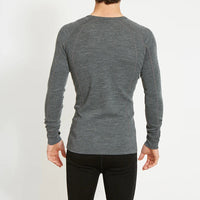 Back of model wearing XTM Mens Merino Top in Mid Grey