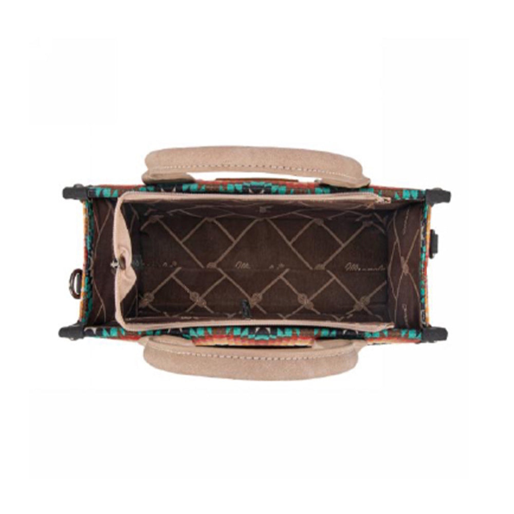 Handbag with colorful patterned interior on a white background