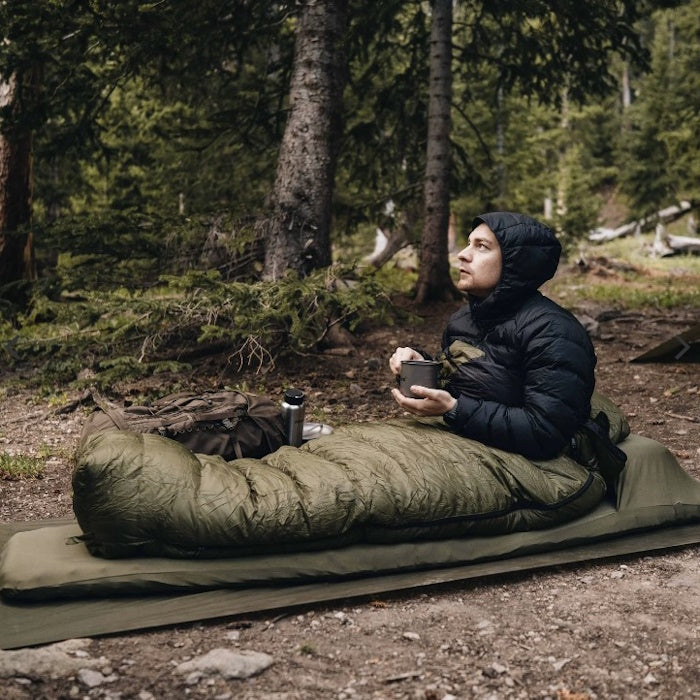 Man sitting up in Alton Goods Ultralight Sleeping Bag -5
