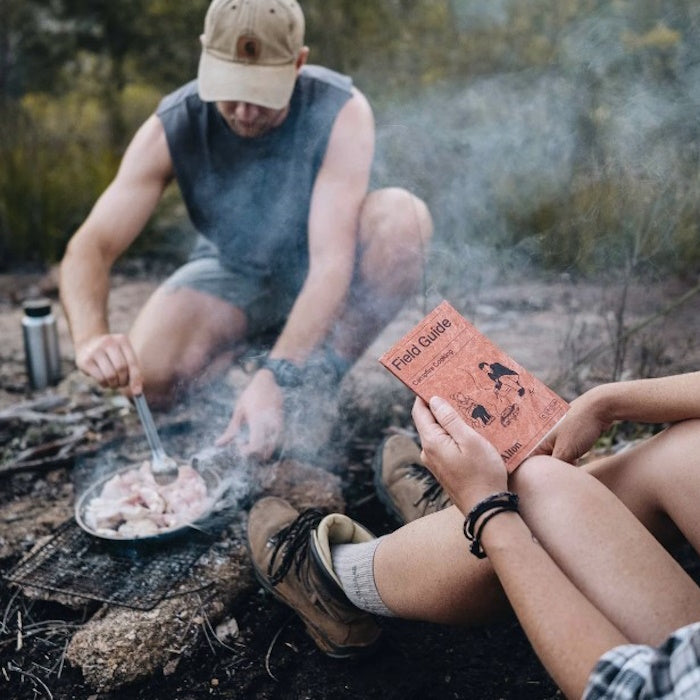 Alton Goods Pocket Campfire Cooking Guide being used in camp