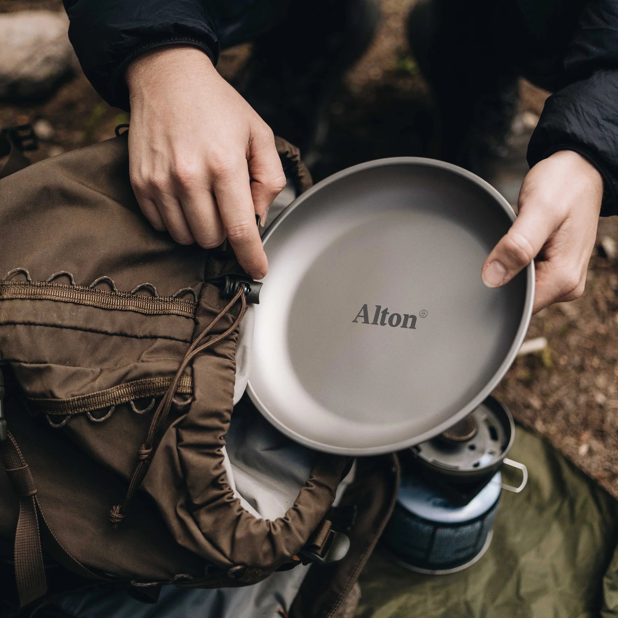 Alton Goods Ultralight Titanium Plate about to placed inside backpack