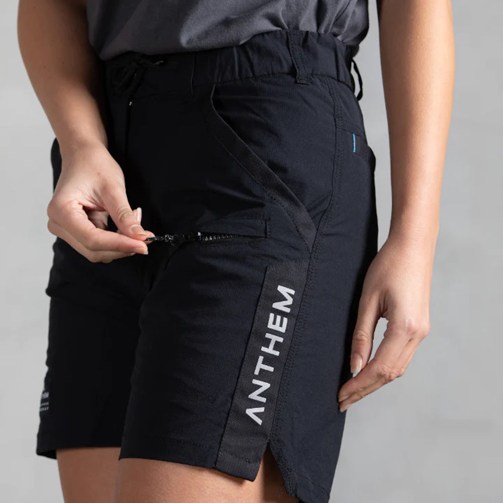 Front pocket being unzipped on Anthem Womens Triumph Shorts in Black