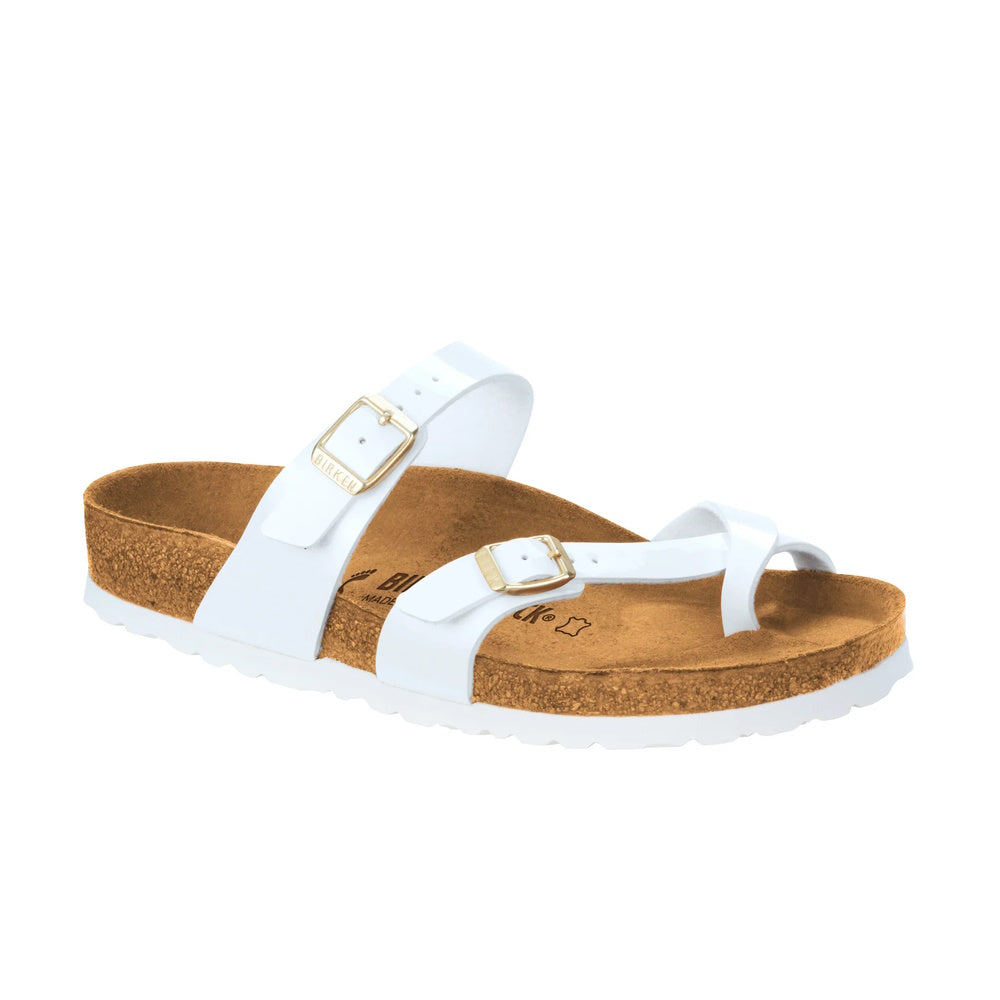 A white Birkenstock Mayari thong sandal with a brown cork-latex footbed, featuring a toe loop and cross strap.