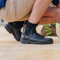 Man crouching in Blundstone 610 Elastic Sided Work Boots