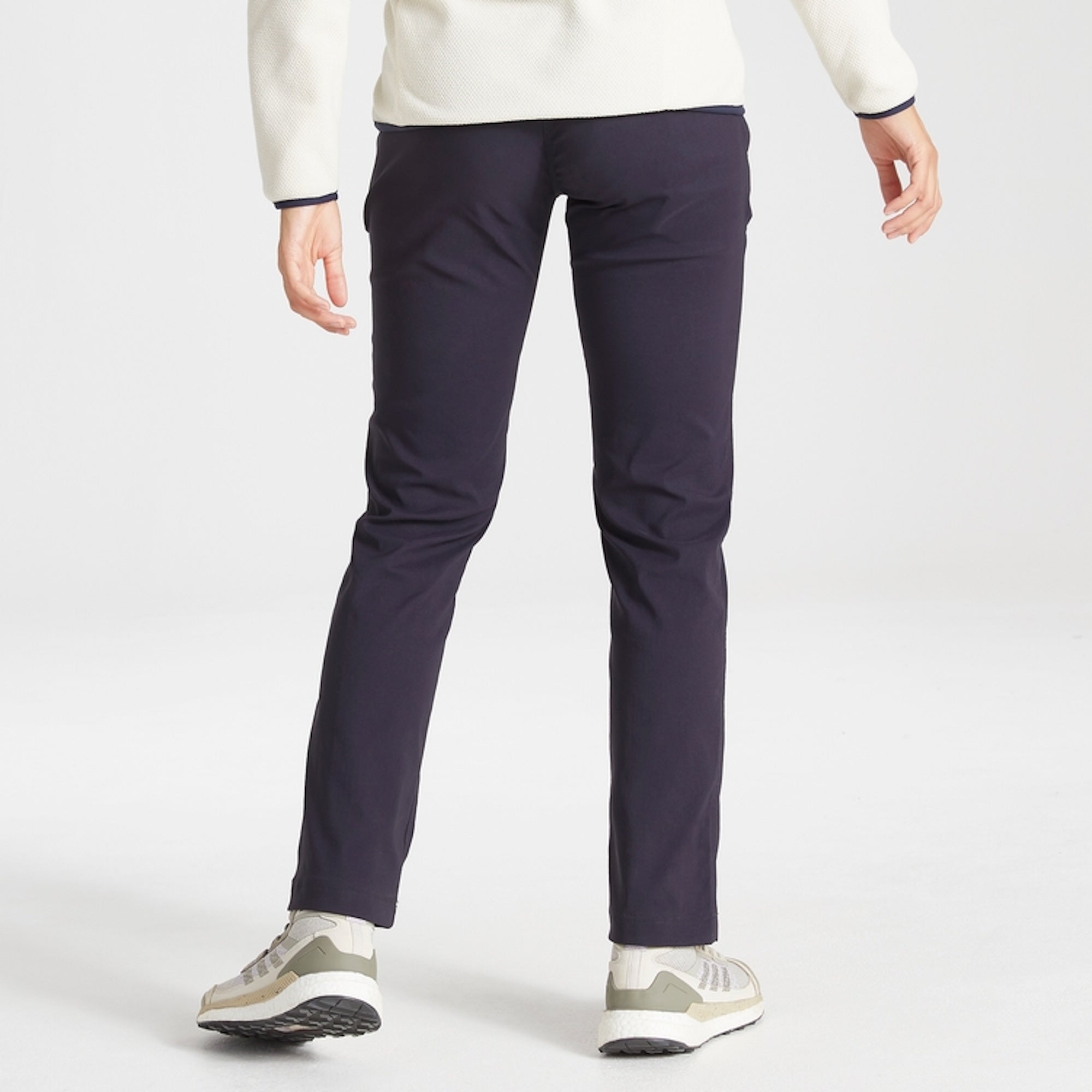 Back of model wearing Craghoppers Womens Kiwi Pro II Trousers in Dark Navy