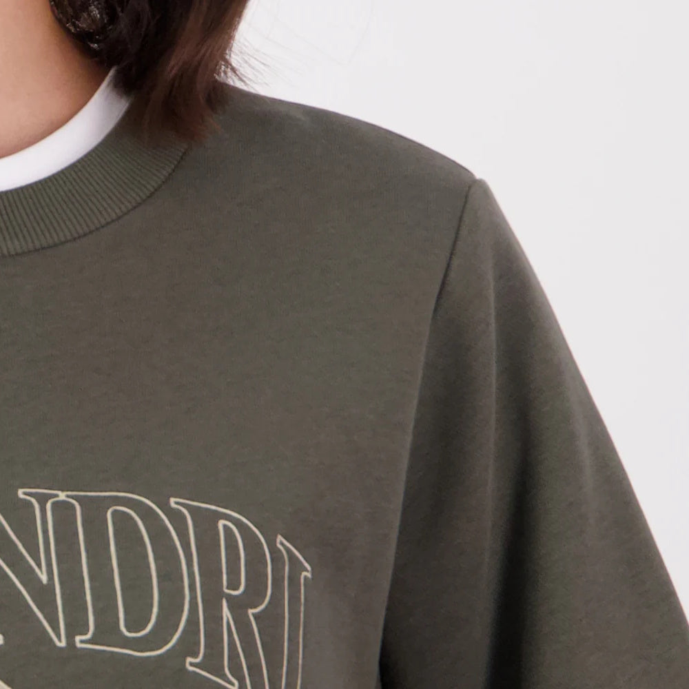 Close up of shoulder on dark olive/horizon grey Swanndri Womens Ivy Embroidered Crew