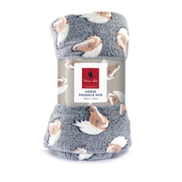 A grey horse-themed Thomas Cook snuggle rug.