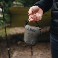 Man holding Alton Goods Ultralight Pillow bag