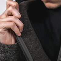 Man opening inside of fleece top