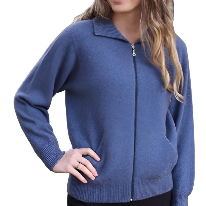 Female model wearing a light blue Lothlorian plain zip cardigan with hand on hip.