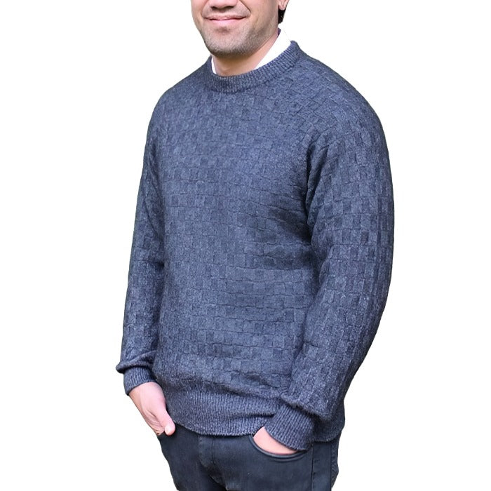Male model wearing Lothlorian Crew Neck Purl Jumper that is made from possum and merino wool in denim colour.