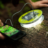 Luci Outdoor 2.0 Pro Solar Lantern charging phone while light is on