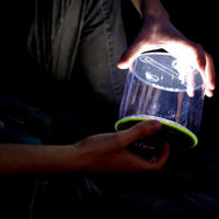 Man holding Luci Outdoor 2.0 Solar Lantern