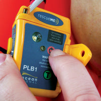 Pressing button on Ocean Signal rescueMe PLB1 Personal Locator Beacon