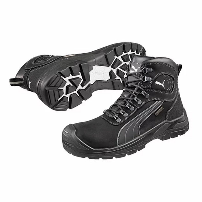 Pair of Puma Sierra Nevada Safety Boots in Black. One boot on it's side with upright boot in front.