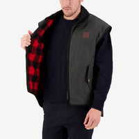 Model opening Swanndri Foxton Oilskin Vest to show Red & Black check inner lining.