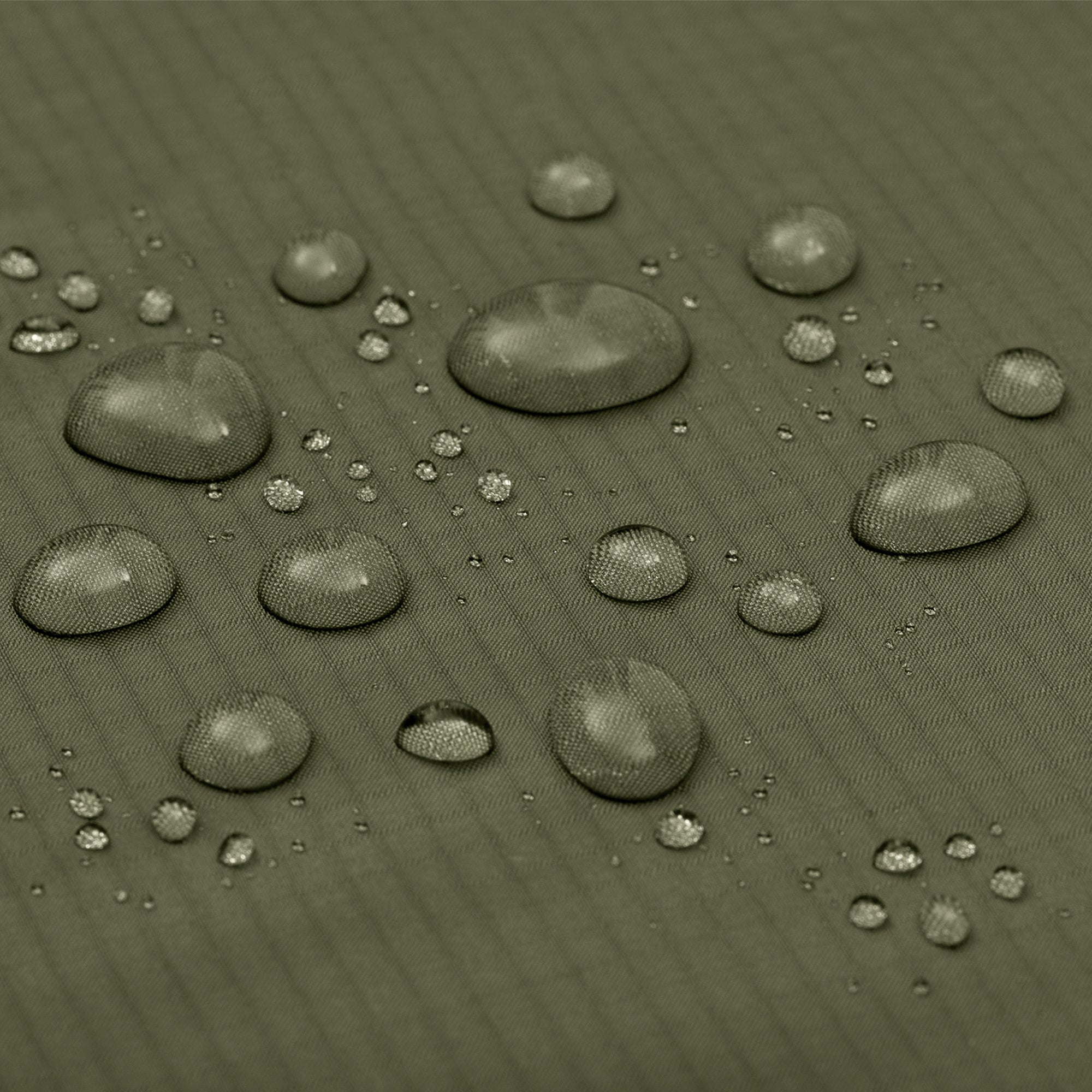 Close up of Alton Goods Ultralight Groundsheet waterproof fabric with beads of water