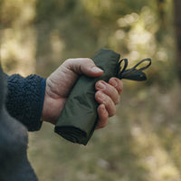Alton Goods Ultralight Groundsheet rolled up in hand of person