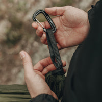 Man holding Alton Goods Ultralight Hammock Carabiner