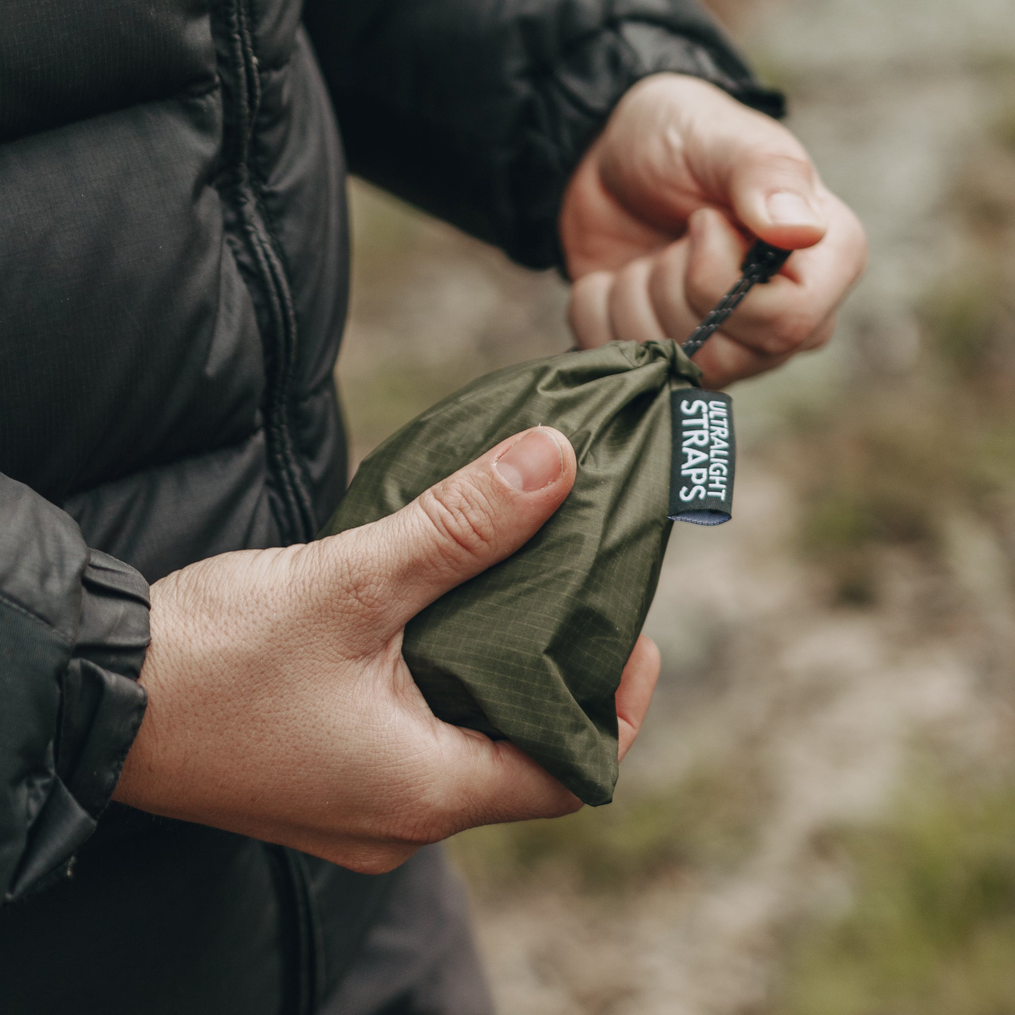 Man holding bag of Alton Goods Ultralight Straps