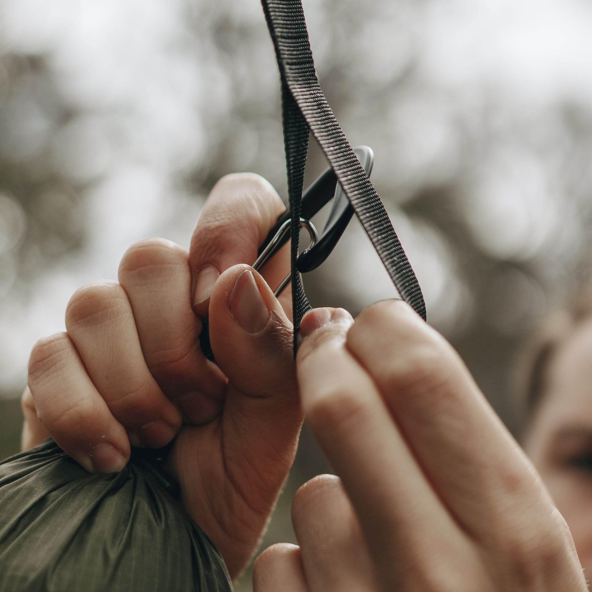 Carabiner attaching to webbing loop