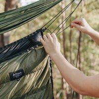 Man tying knot on Alton Goods Ultralight Underquilt