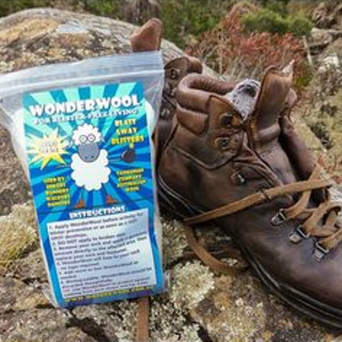 WonderWool 25G Bag next to pair of boots