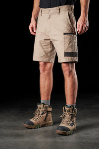 Model wearing FXD WS-3 Men's Stretch Work Shorts in Khaki