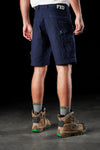 Back view of model wearing FXD WS-3 Men's Stretch Work Shorts in Navy