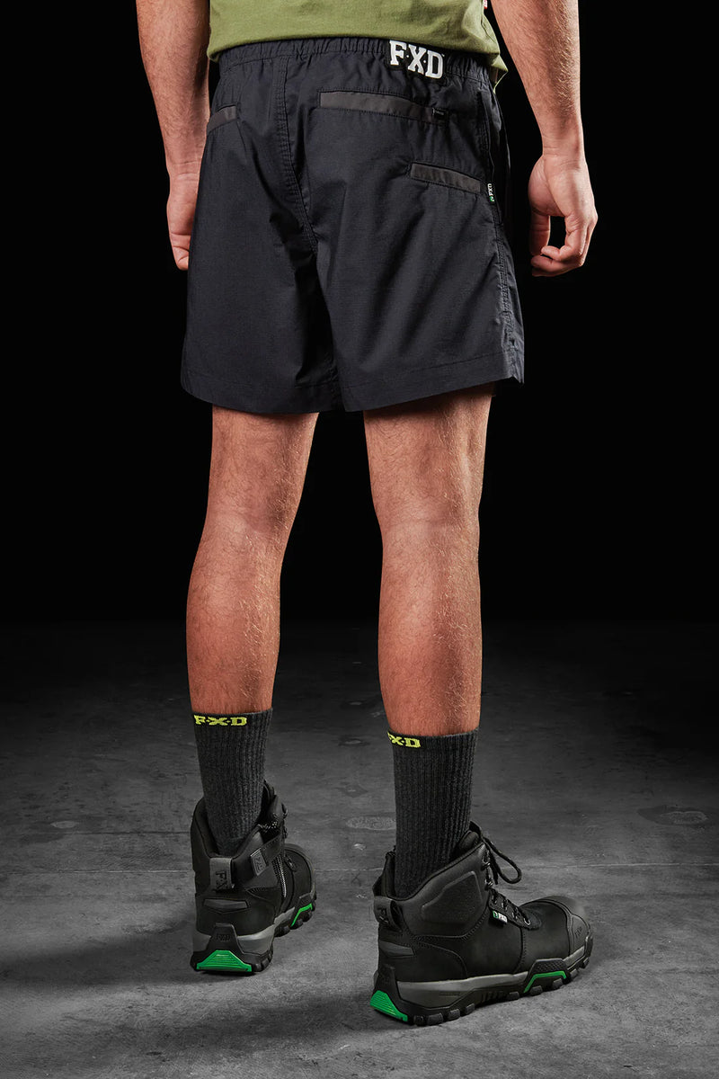 Back view of model wearing Black FXD WS-4 Men's Repreve Stretch Ripstop Work Shorts