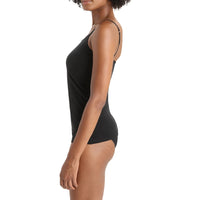 A woman shown in side profile wearing a black Icebreaker camisole with thin straps.