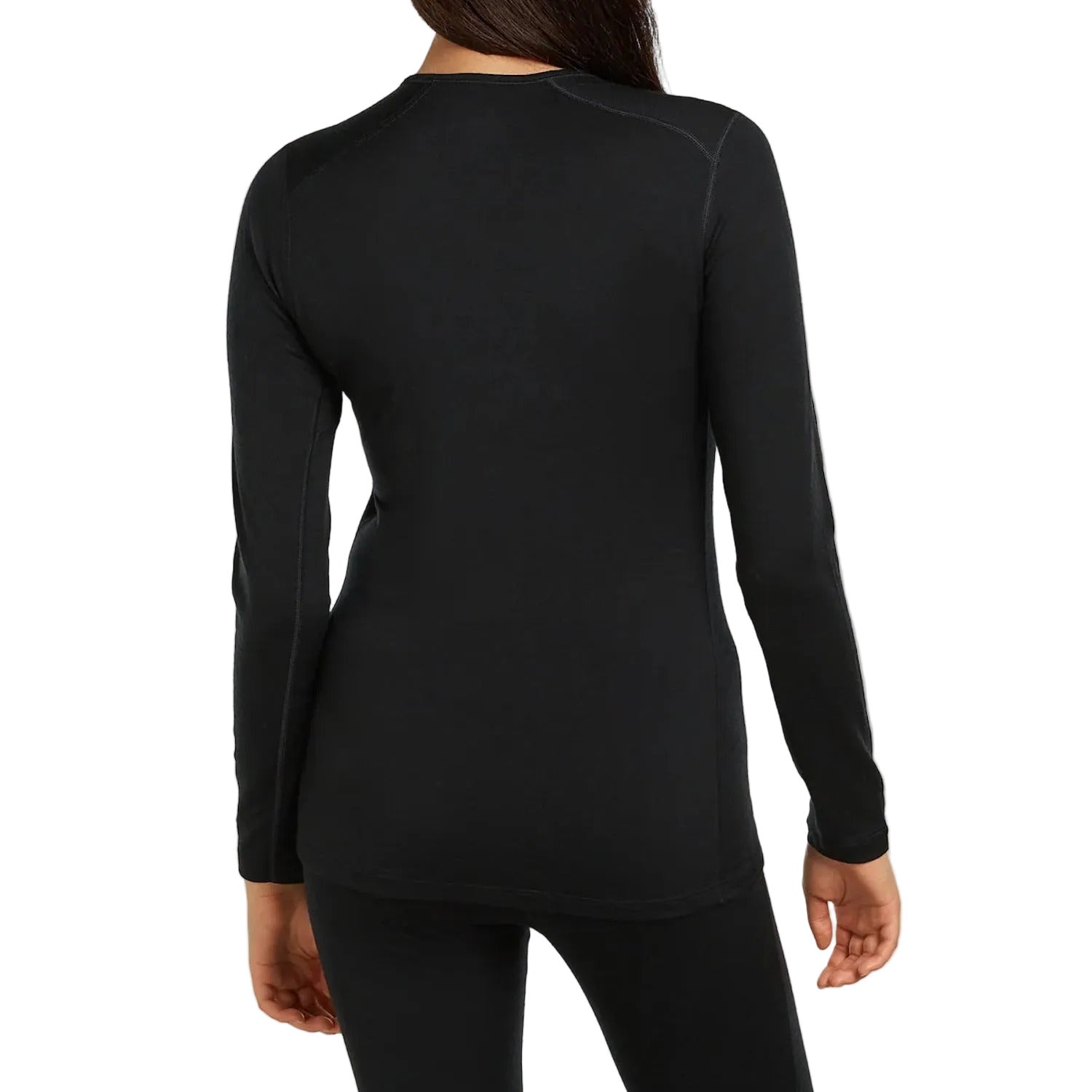 A woman viewed from the back wearing a fitted black Icebreaker long sleeve top and black leggings.