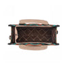 Handbag with colorful patterned interior on a white background