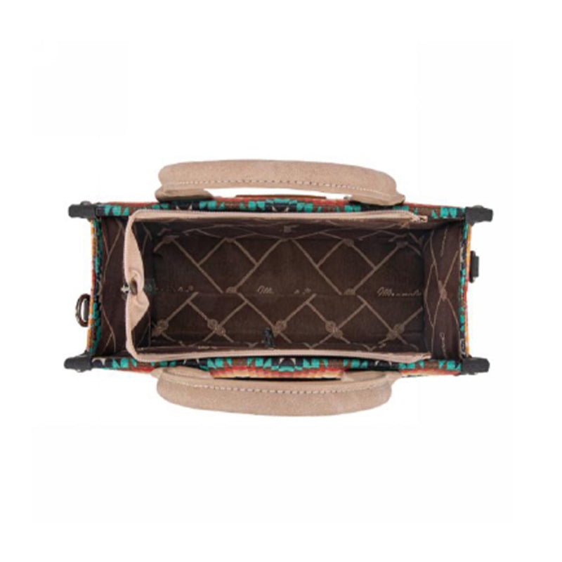 Handbag with colorful patterned interior on a white background