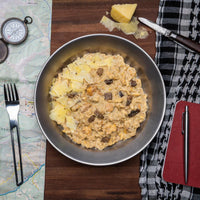 Bowl of creamy chicken pasta with parmesan cheese and mushrooms