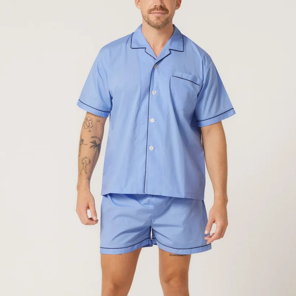 Man wearing a light blue Contare pyjama short sleeve set.