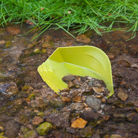Gold Claw Speed Pan in Green in a river