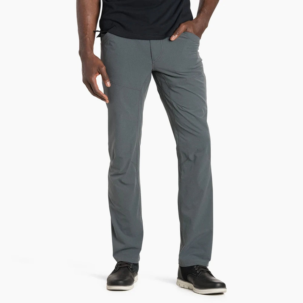 Person wearing Kuhl men's Silencr carbon pants