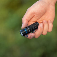 Olight Baton 4 Rechargeable 1300 Lumens Torch in Hand