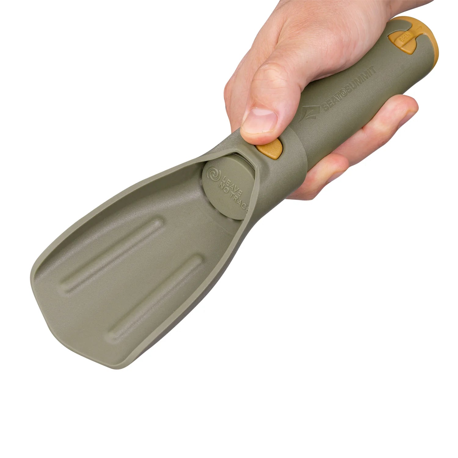 Hand holding a green Sea to Summit pocket trowel