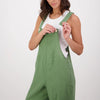 Woman wearing green overalls