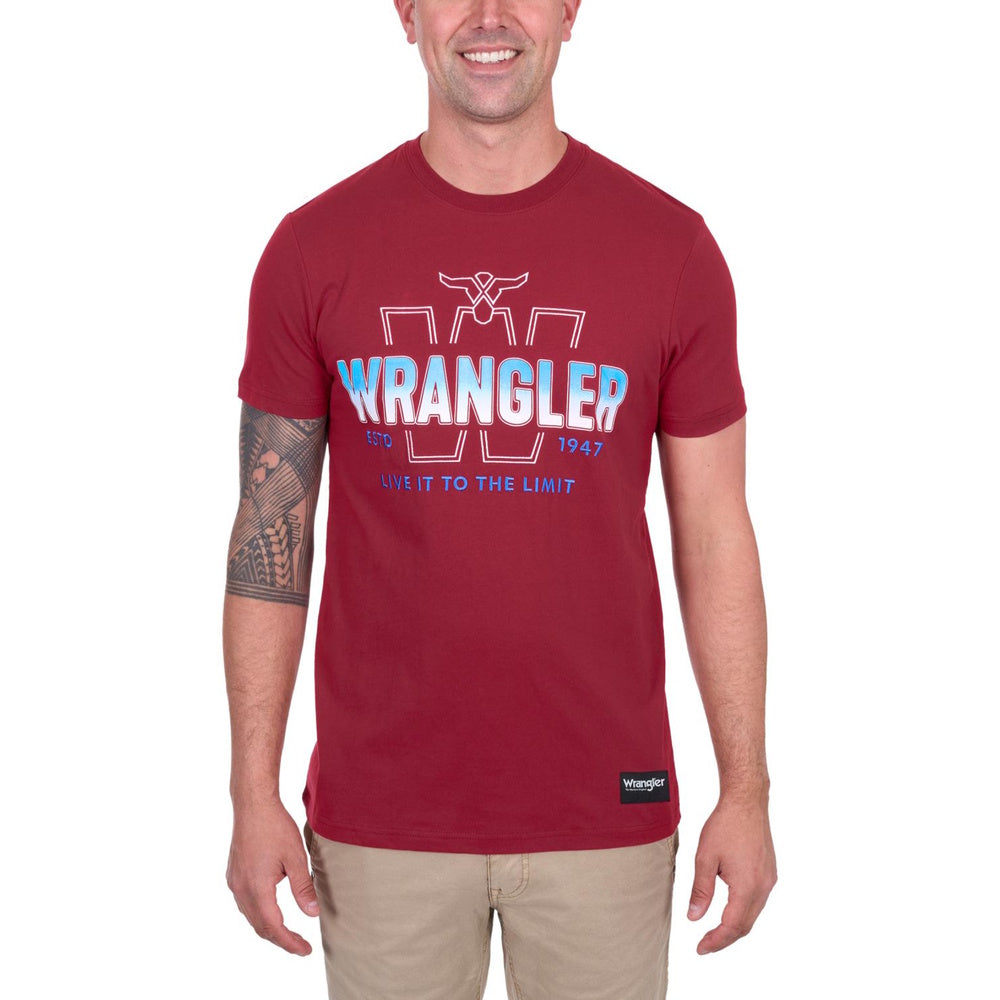 Man wearing a red Wrangler t-shirt with logo and text