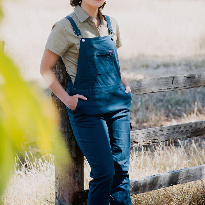 Woman wearing Blue Green Hip Womens Overalls out in the field 