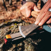 Axe being sharpened Work Sharp Guided Field Sharpener